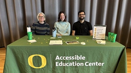Accessibility Education Center employees tabling at a resource fair event.