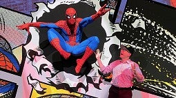 UO professor Ben Saunders and life-size Spider Man poster