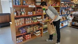 Stocking shelves at the Student Food Pantry