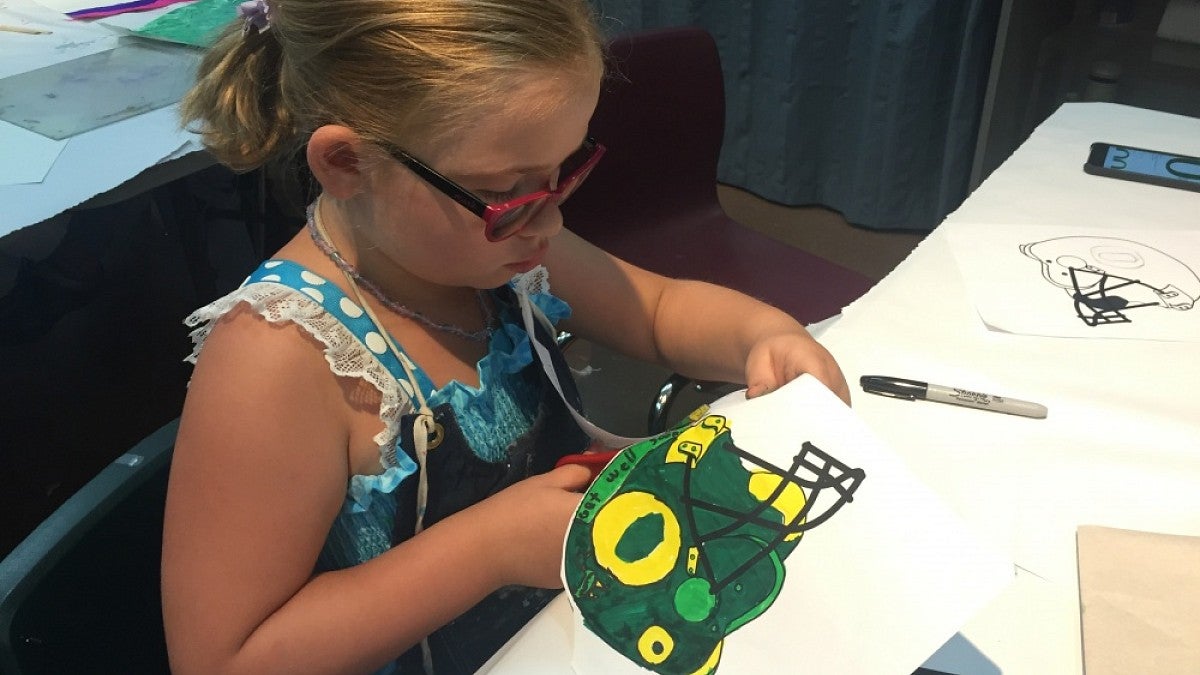 A youngster working on a project in the Art Heals program.