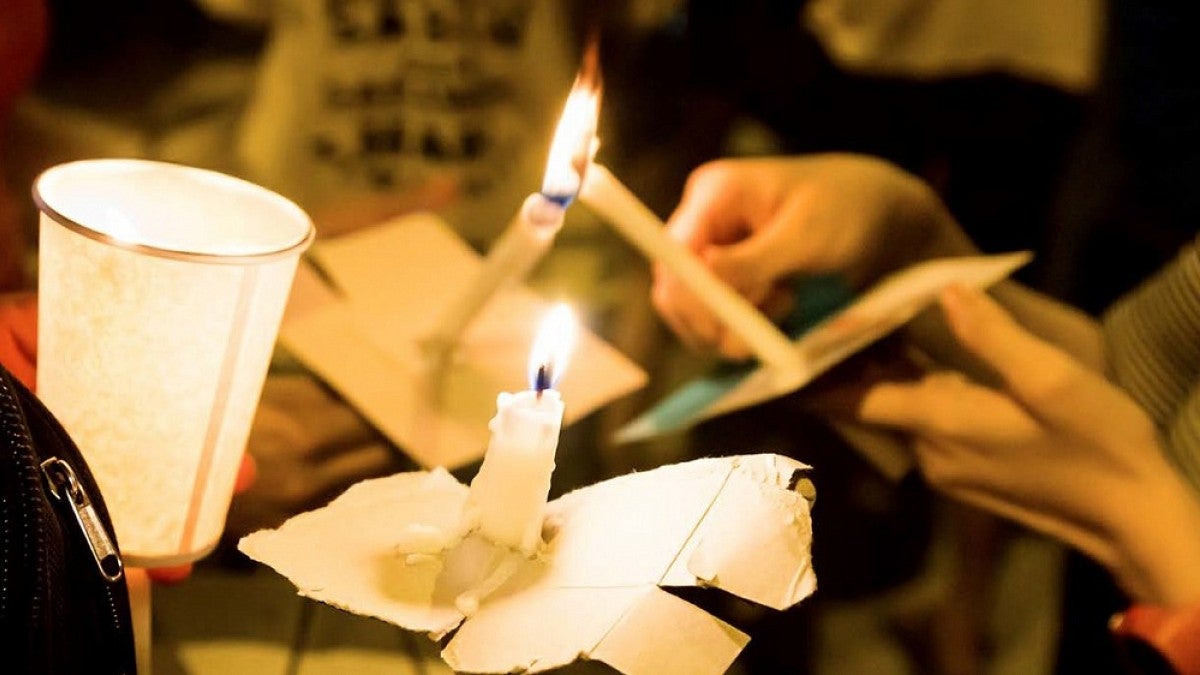 Candles being lit at a vigil