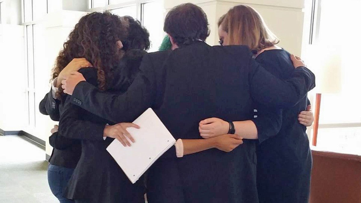 Mock trial teams huddle up before a December competition