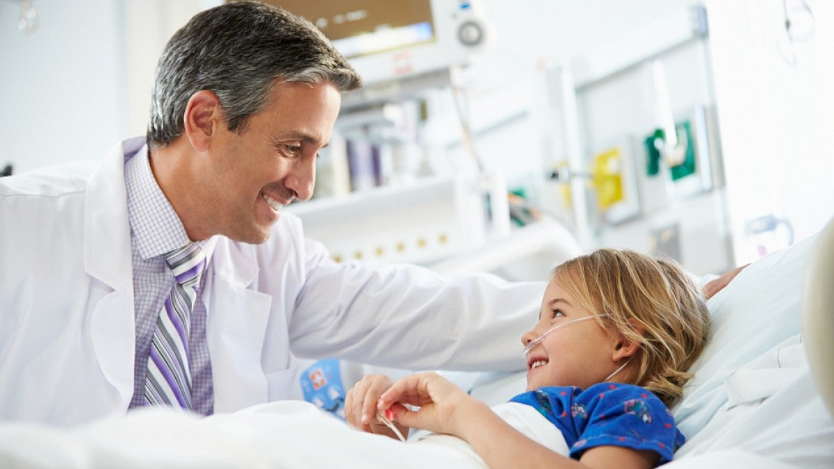Doctor treating child in hospital
