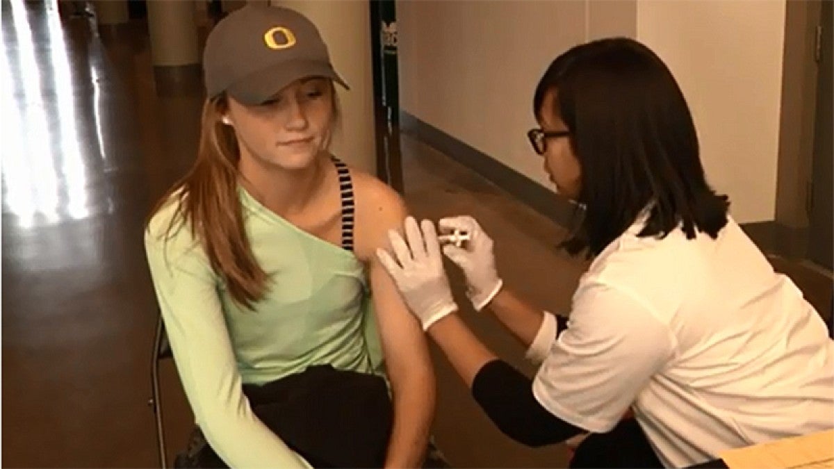 A student being vaccinated at last year's clinic in Matthew Knight Arena