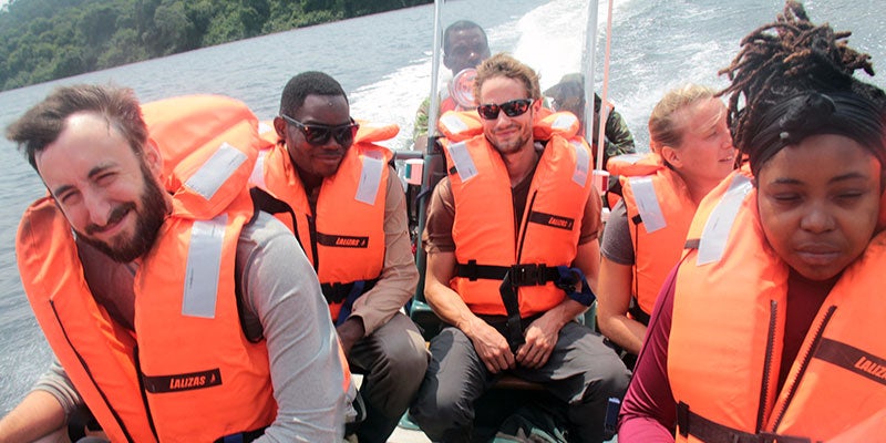 Aaron Nelson on a boat in Gabon