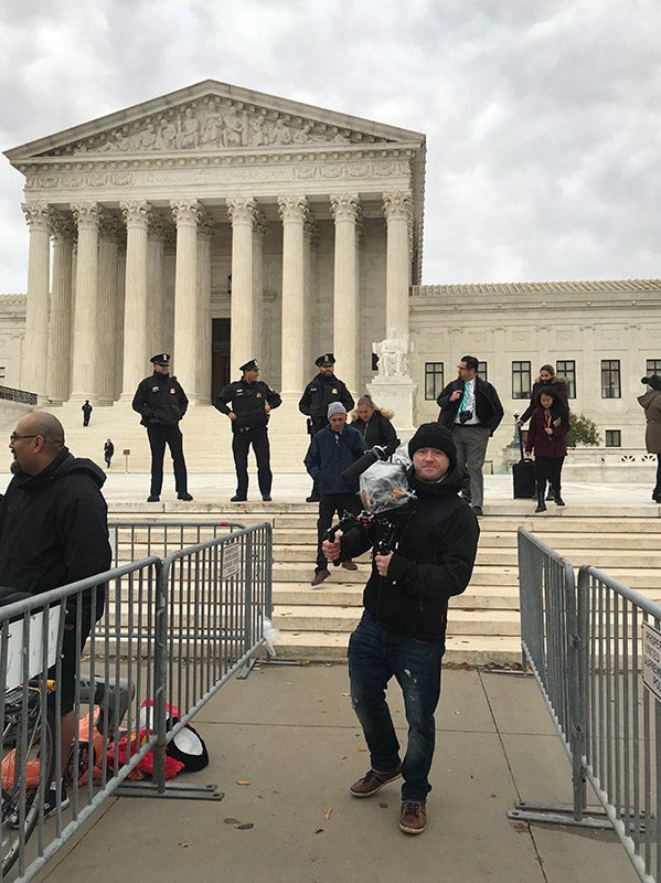 Adam Markle in front of the Supreme Court of the United States.