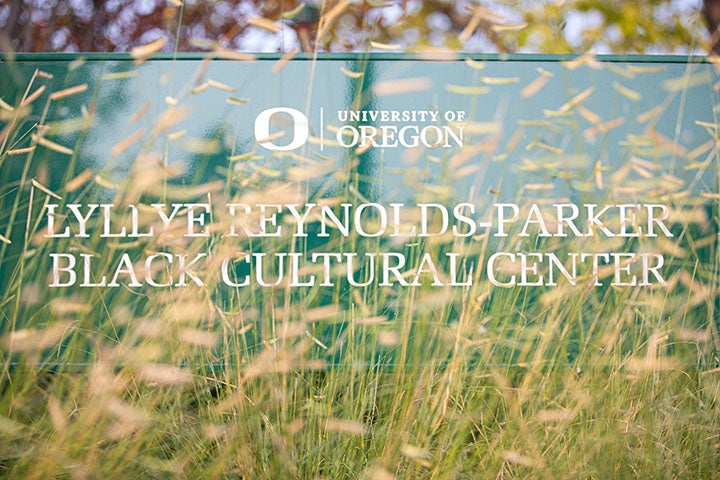 Lyllye Reynolds-Parker Black Cultural Center sign as viewed through plants