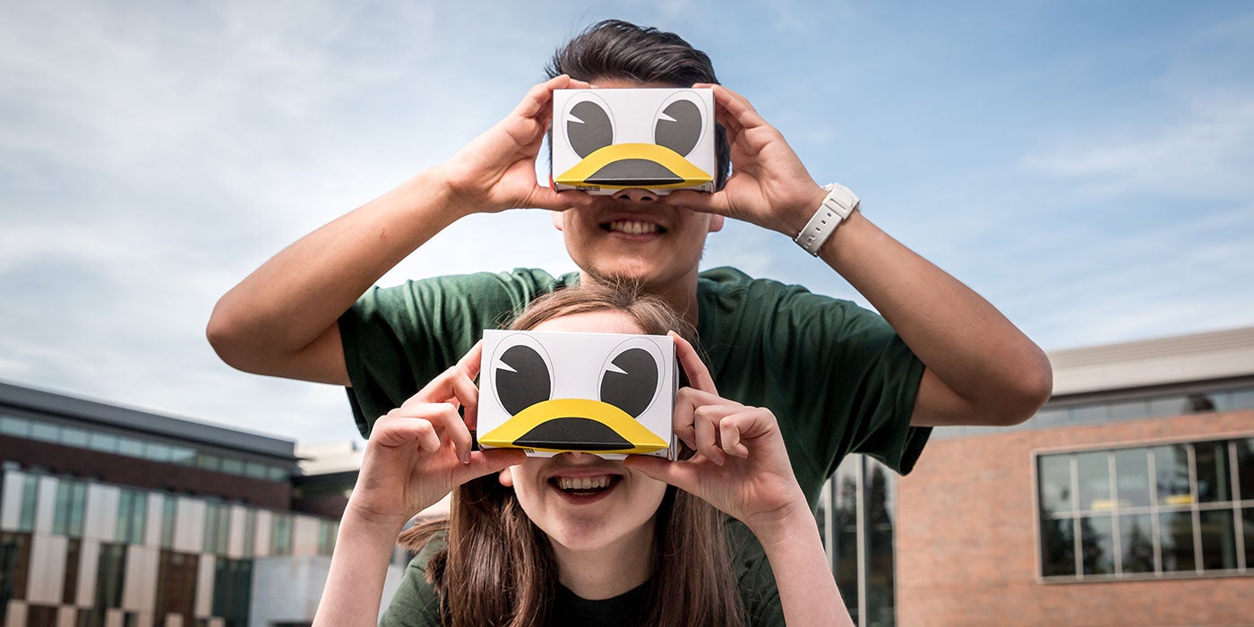 Hannah Lewman and Travis Kim with the Duck VR goggles