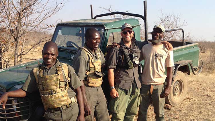 Jess Kokkeler with members of the International Anti-Poaching Federation team in Zimbabwe