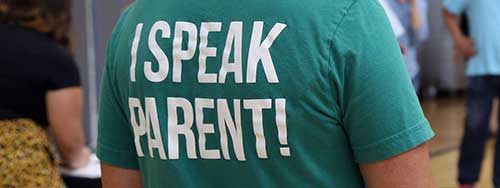 The back of a shirt that says I speak parent