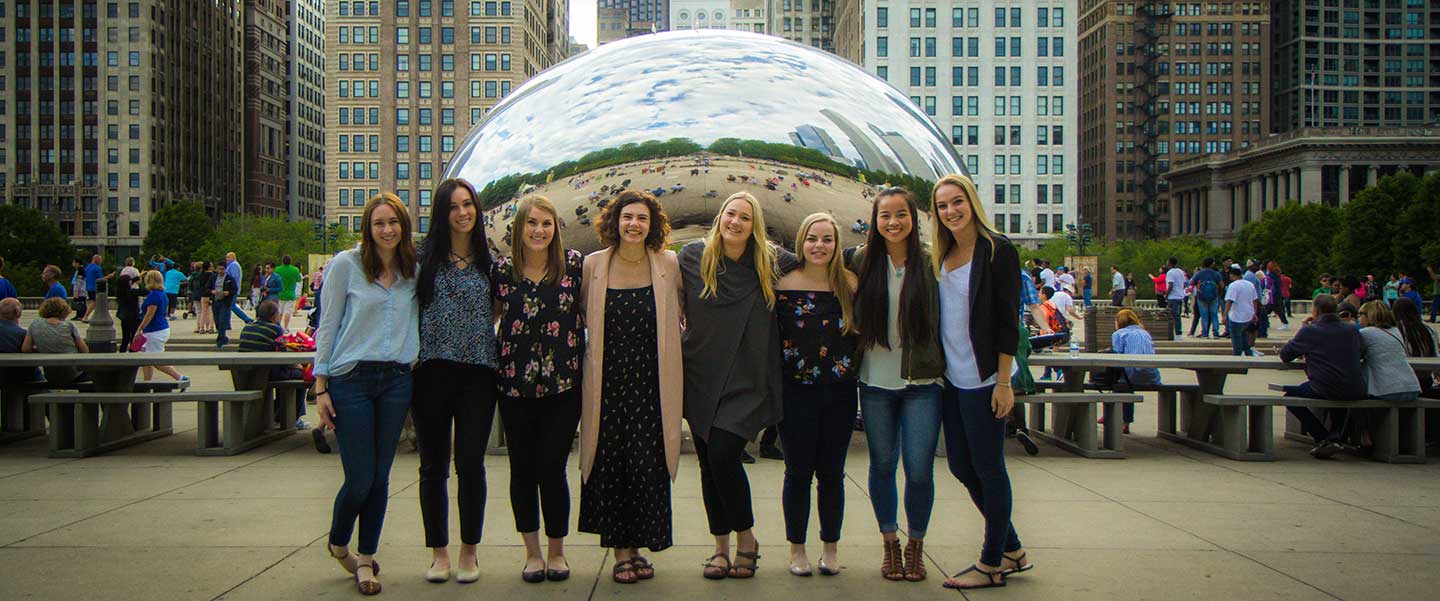 University of Oregon School of Journalism and Communications students from public relations visit the cloud gate sculpture in Millennium Park in Chicago
