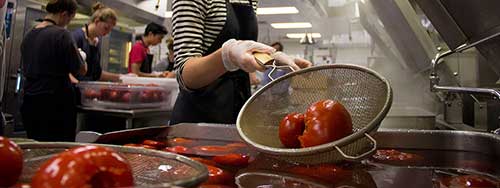 Blanching tomatoes in hot water as part of Project Tomato