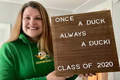 Professor Tiffany Brown with a sign that says Once a Duck, Always a Duck 2020