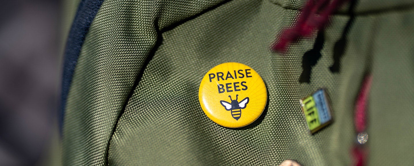 Person wearing a &quot;Save the Bees&quot; button