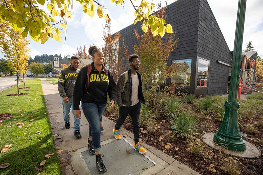 Students walking in front of the Lyllye Reynolds-Parker Black Cultural Center