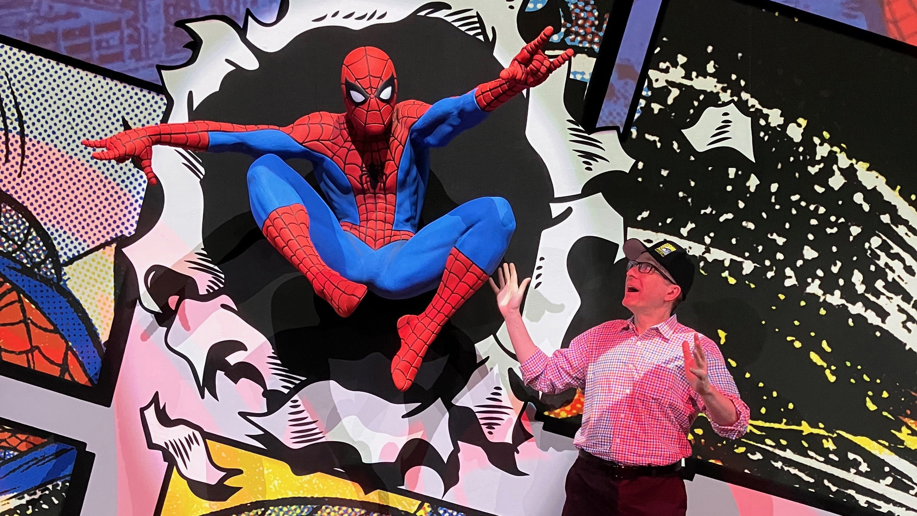 Ben Saunders, professor of English, at Comic-Con Spider-Man exhibit 