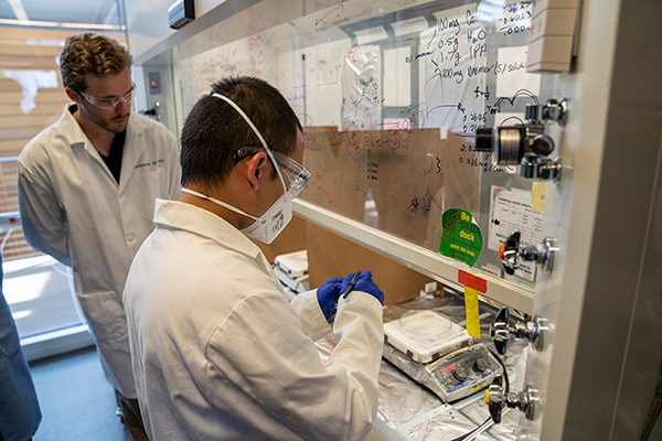Postdoctoral fellow James Mitchell and PhD student Haokun Chen prepare catalyst layers for bipolar membranes used in acid and base production (Chris Larsen, University Communications)