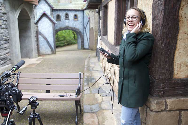 In 2014, the NW Stories team produced documentaries around Oregon. In this photo, student Amanda Butt reviews audio captured on location at the Enchanted Forest theme park outside Salem.