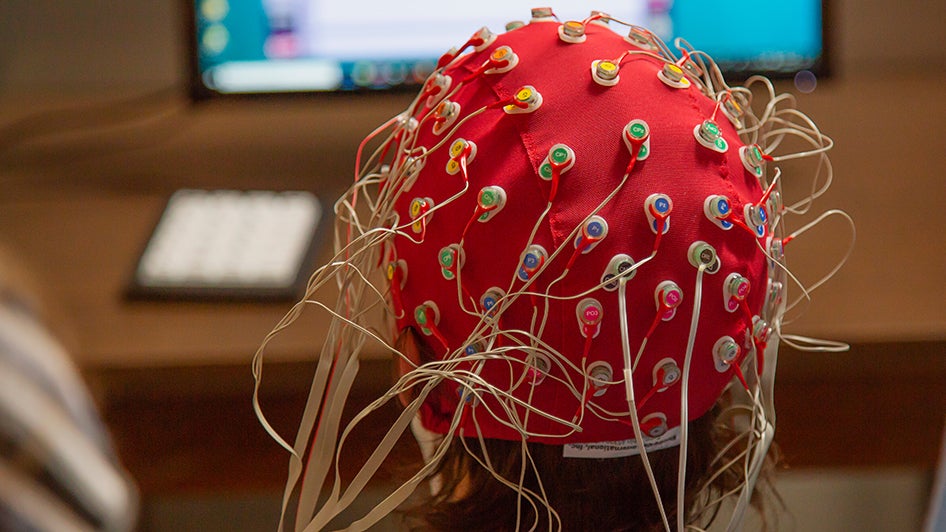 Test subject wearing brain sensor net