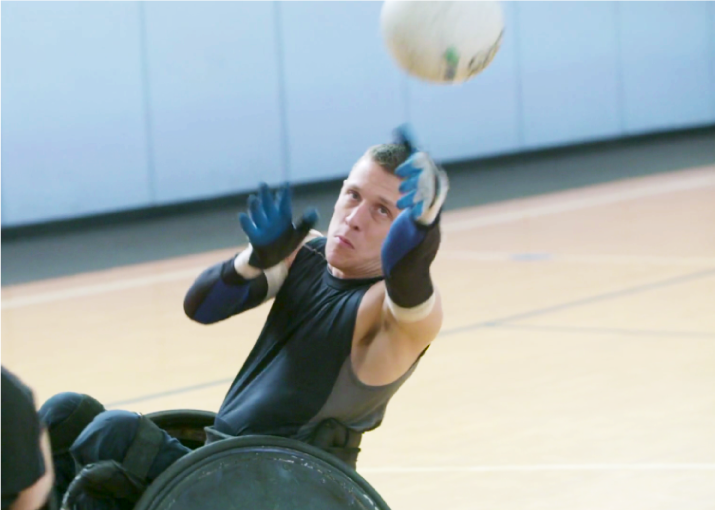 Seth McBride passes the ball during a Portland Pounders wheelchair rugby practice