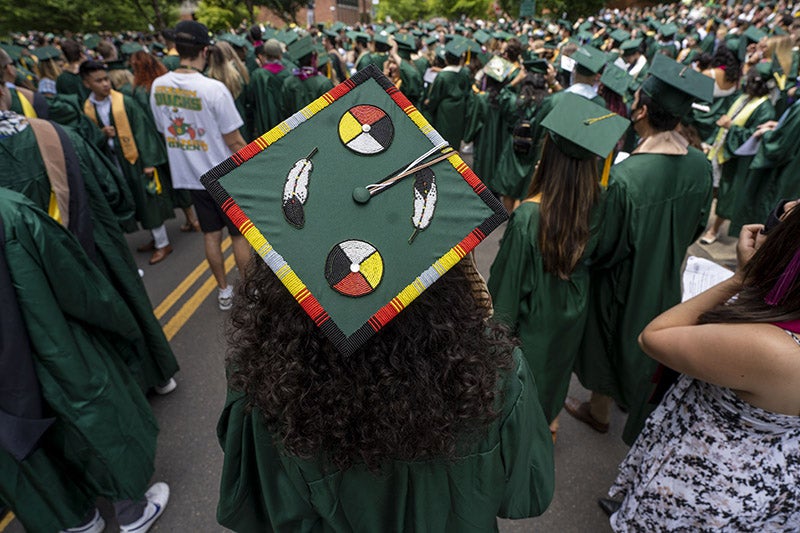 A graduation cap with Native American heritage colors and symbols