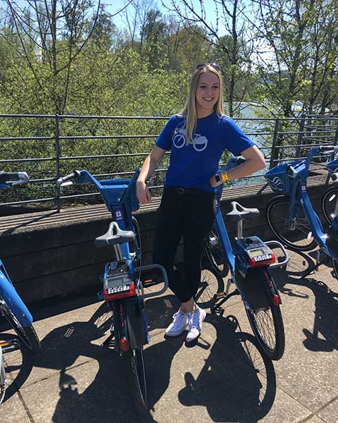 Kim Duyck posing with some of the PeaceHealth RIdes bikes