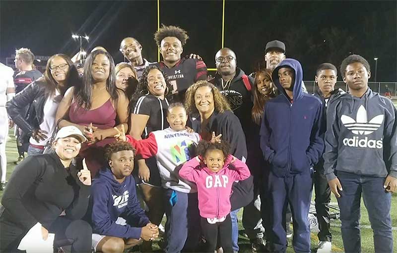 Kayvon Thibodeaux with his family after a high school football game