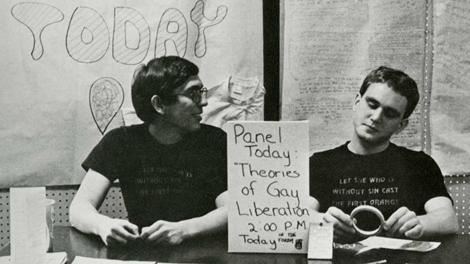 Students staff a booth for Gay Pride Week in the late 1970s