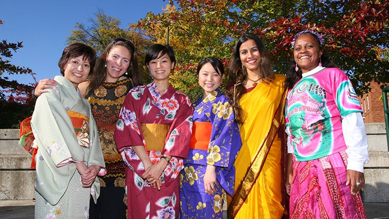 Group of people at the University of Oregon wearing culturally diverse formal wear