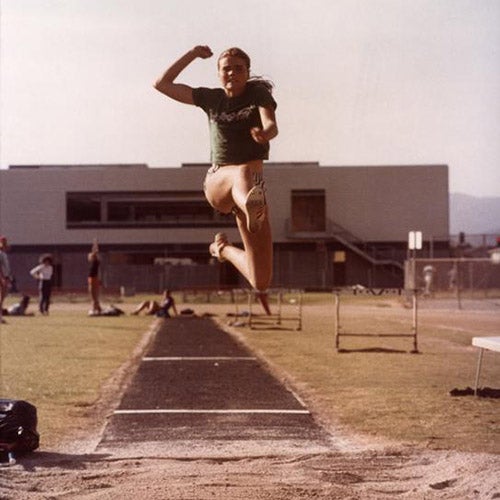 Still from the film 'Personal Best' showing a woman in the air during a long jump. Photo courtesy of Oregon Digital