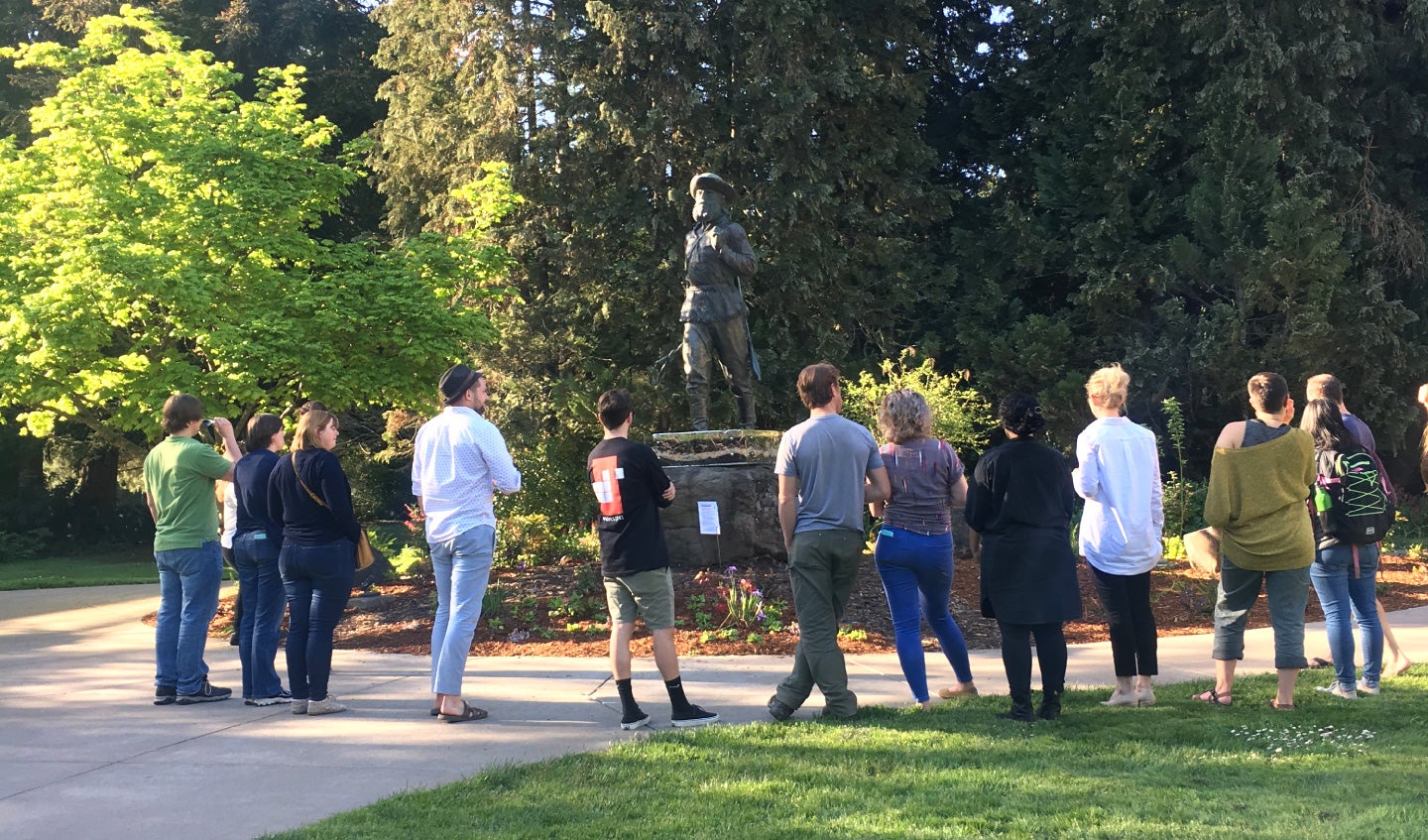 Students near the Pioneer Father statue