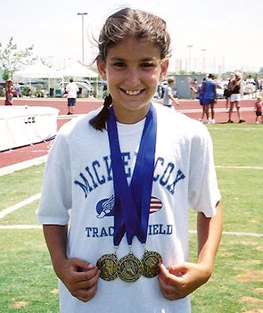 A young Jenna Prandini with her medals
