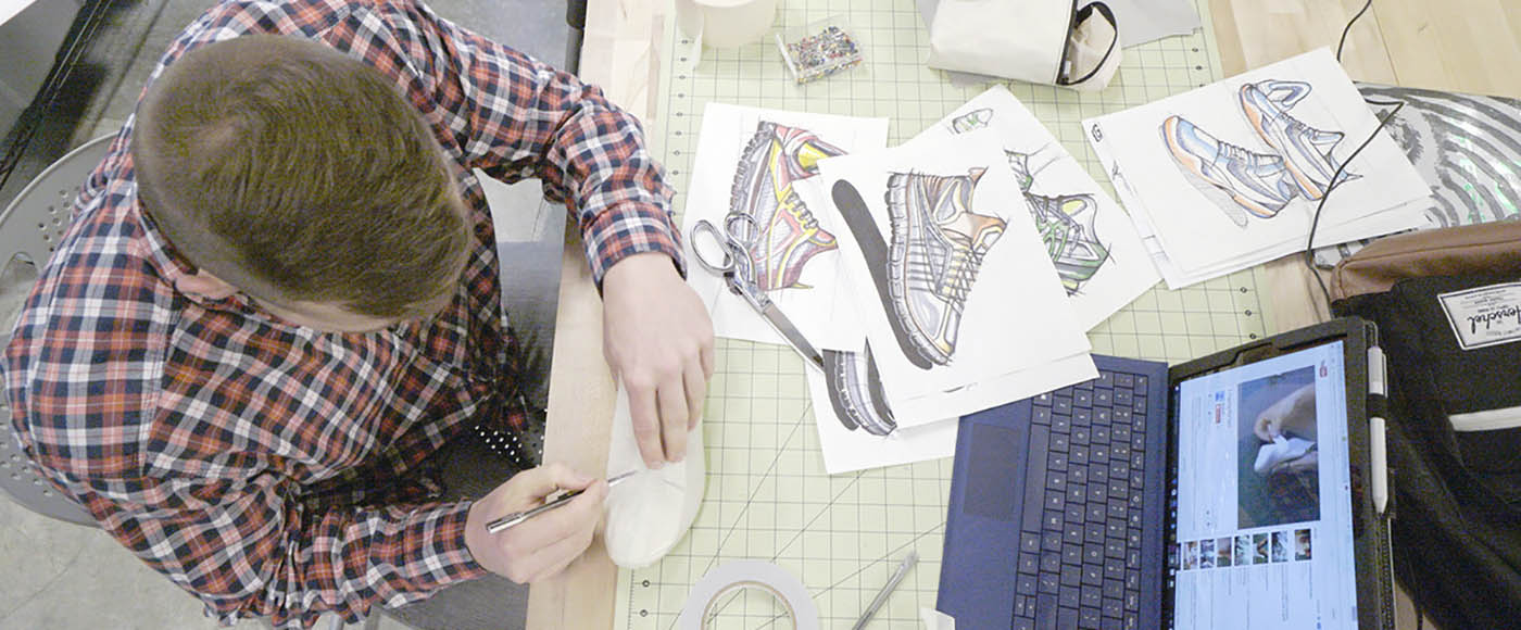 Overhead view of a student prototyping a shoe