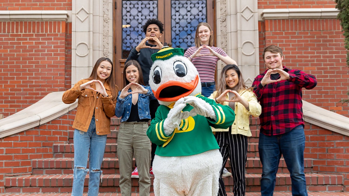 The Duck with students &quot;Throwing the 'O'&quot; on the steps of Chapman Hall