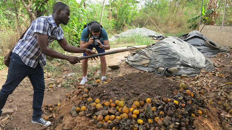 A student photographs the composting process for a campaign to promote its benefits in Accra, Ghana.