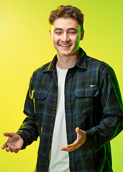 Shane Hoffman pictured in front of a vivid yellow background