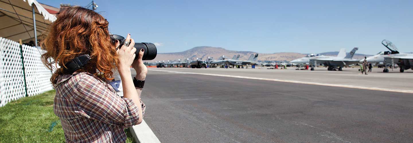 Hannah Steinkopf-Frank photographing military aircraft