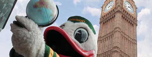The Duck holding a globe in front of Big Ben in London