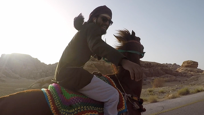 Riding a camel in Jordan