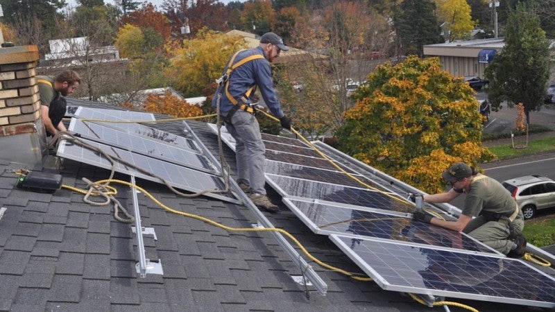 Rooftop solar panels being installed