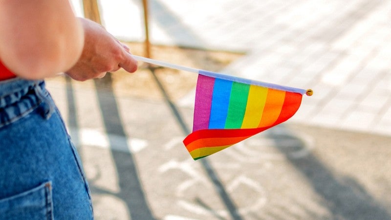 Person with rainbow flag