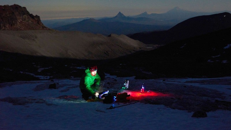 Researchers on a glacier at night