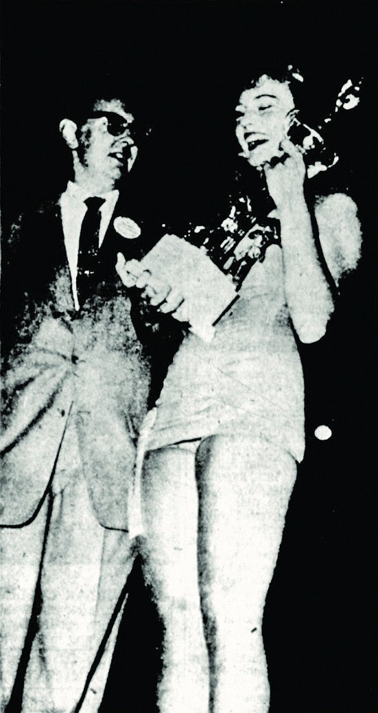 Nancy Whaller receiving trophy as Miss Press Photographer, August 11, 1958, Eugene. Photograph courtesy The Register Guard