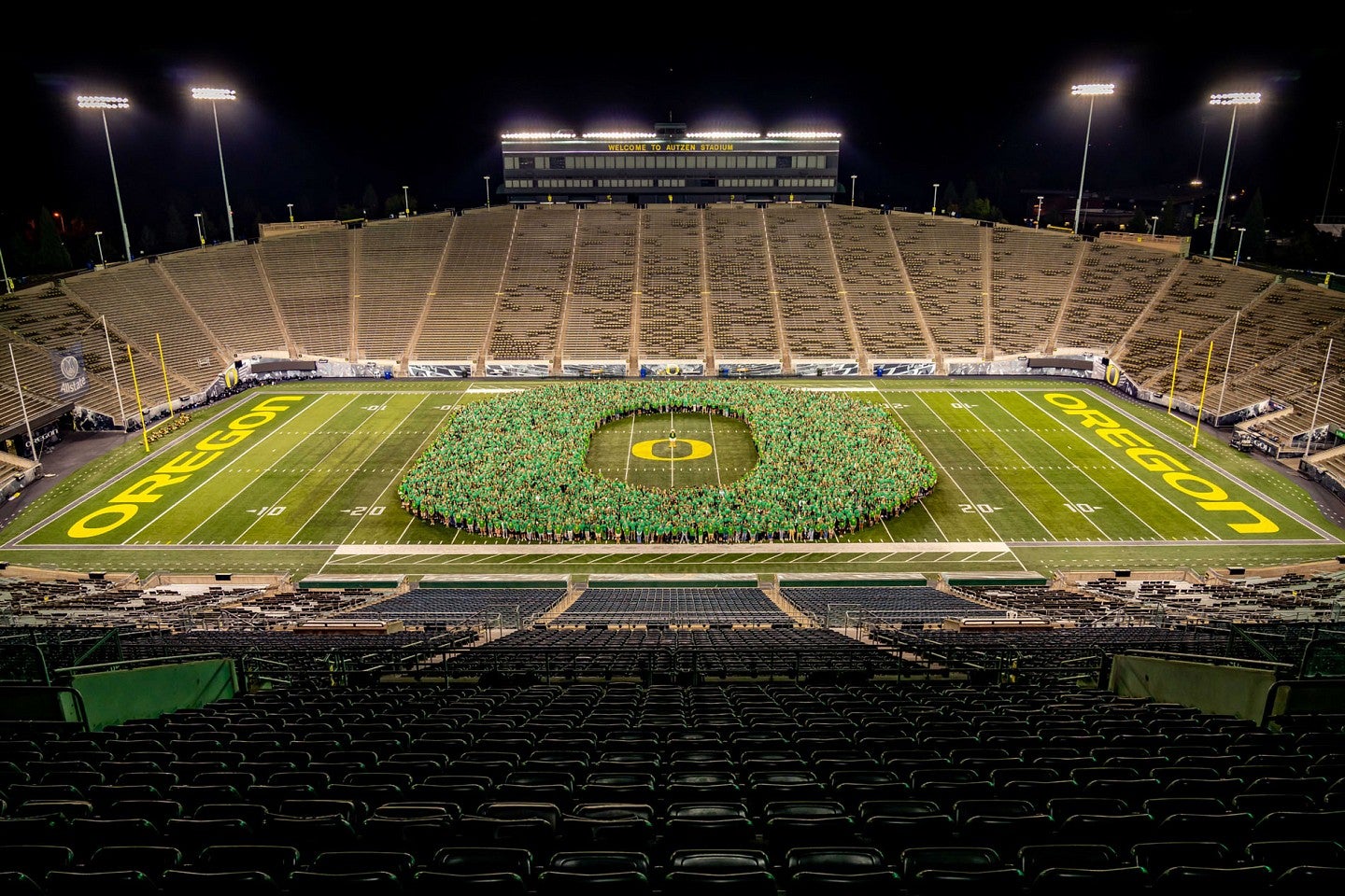Class of 2026 forming the Oregon "O" in the middle of Autzen Stadium