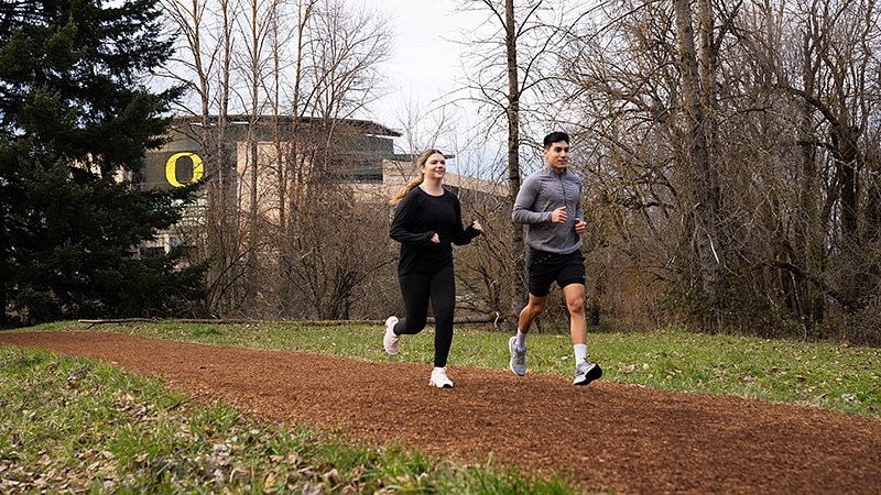 Runners on the Pres Trail near Autzen stadium