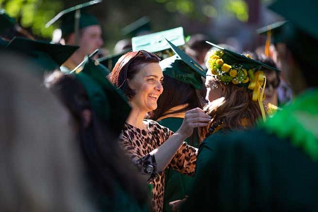 A family member congratulating a graduate