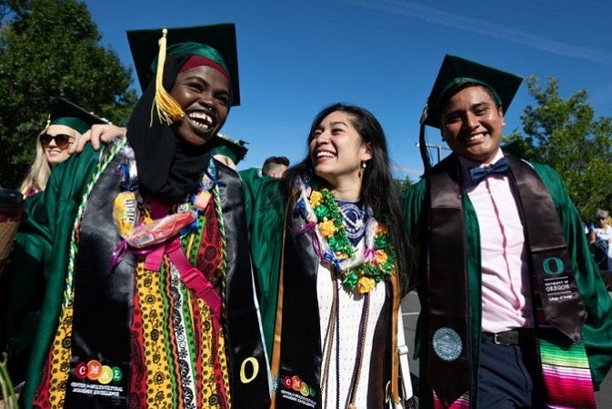 Students in caps and gowns at the 2019 UO Graduation