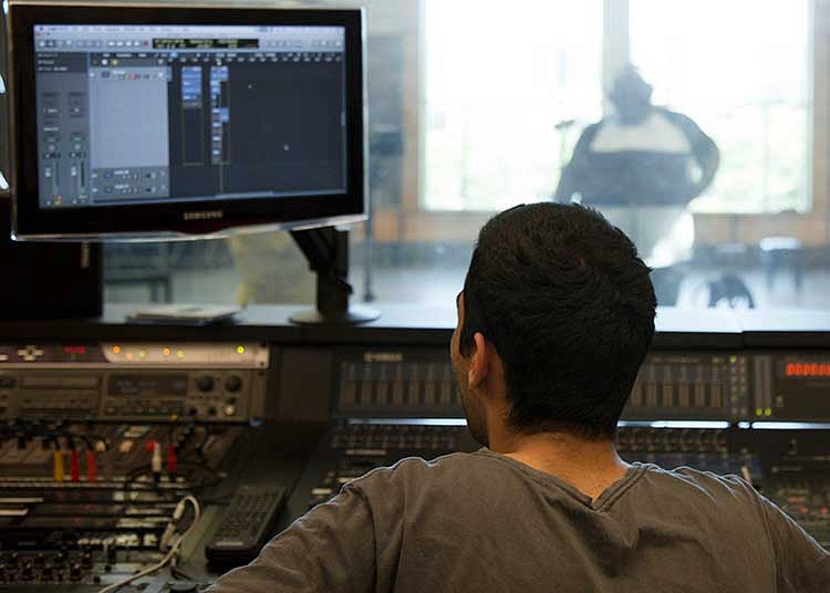 Student in a recording booth