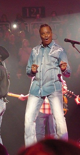 Bailey on stage performing with Garth Brooks
