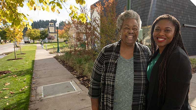 Lyllye Reynolds-Parker and Aris Hall in front of the Black Cultural Center